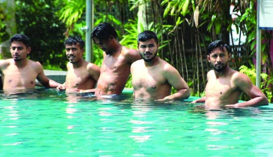 Players of Bangladesh Football team do swimming at the swimming pool of team hotel in Kuala Lumpur, the capital city of Malaysia on Sunday. Agency photo