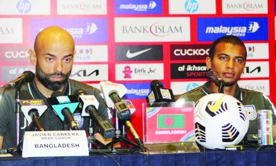 Head Coach of Bangladesh Football team Javier Cabrera (left) speaks at a press conference in Kuala Lumpur, the capital city of Malaysia on Monday. Agency photo
