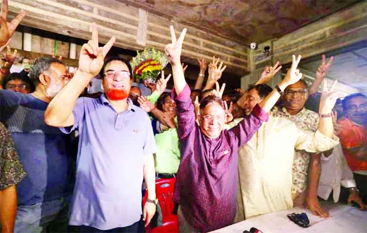Awami League's mayoral candidate Arfanul Haque Rifat celebrates his victory after announcing the result of the Cumilla City Corporation elections on Wednesday. Local MP Bahauddin Bahar is also seen with him rejoicing.