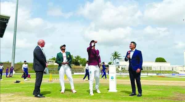 Captain of West Indies Cricket team Kraigg Brathwaite (second from right) chooses to bowl after winning the toss against Bangladesh on the first day of the first Test at Sir Vivian Richards Stadium in North Sound, Antigua on Thursday.