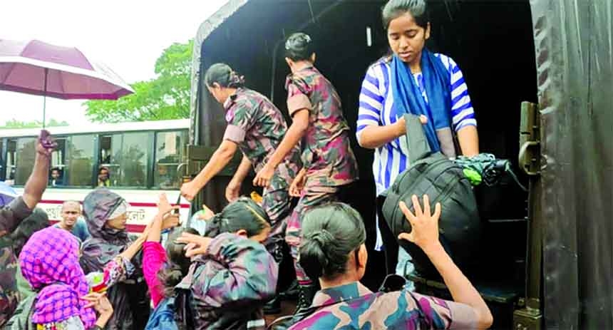 Members of the Border Guards Bangladesh (BGB) are seen on Friday rescuing the female students of Shahjalal University of Science and Technology who were stuck in their residential halls due to ongoing flood that washed away almost the whole Sylhet region.