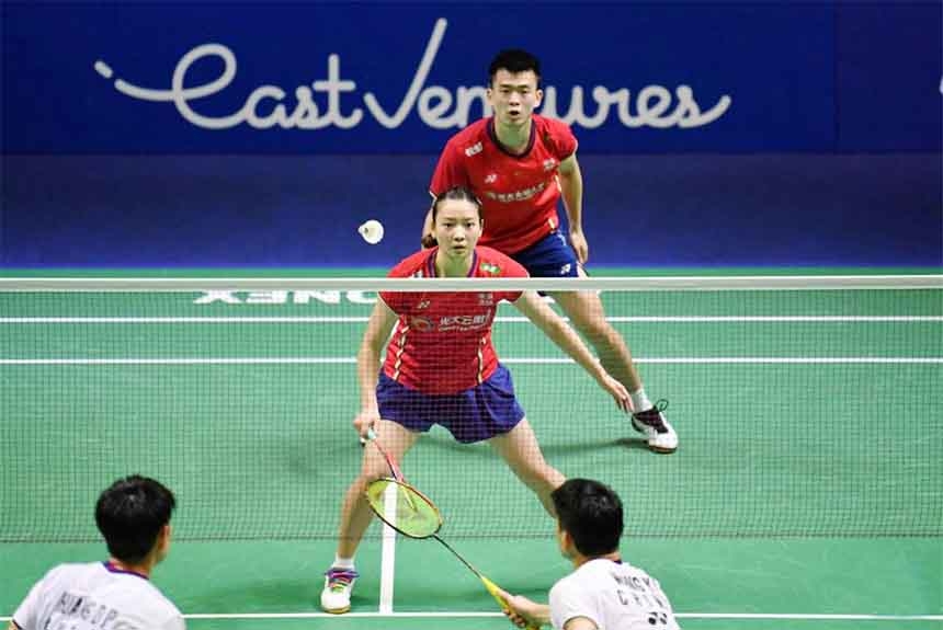 China's Zheng Siwei (rear right)Huang Yaqiong (rear left) compete during the mixed doubles semifinal match against their compatriots Wang YilyuHuang Dongping at Indonesia Open 2022 at the Istora Senayan sports stadium in Jakarta, Indonesia on Saturday.