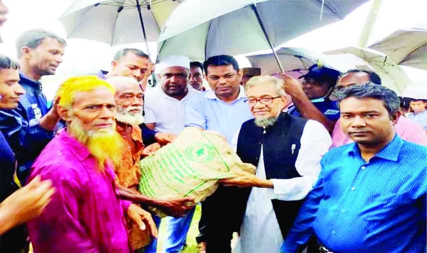 GANGACHARA (Rangpur): Md Asib Ahsan, DC, Rangpur distributes relief materials among the people of flooded areas in Gangachara Upazila recently.