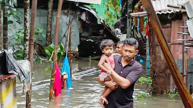 SDRF members carry out rescue work in a flood-hit locality in Bongaigaon town of Assam on Sunday..