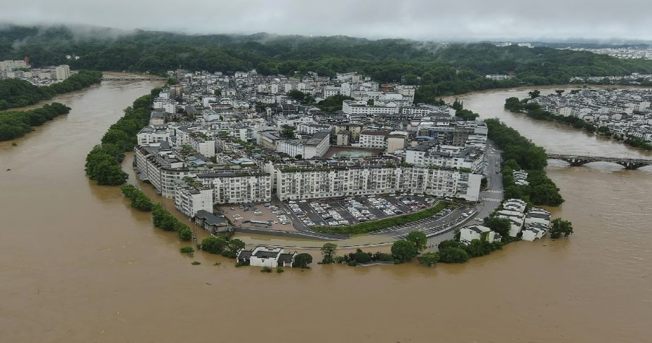 In this photo released by Xinhua News Agency, aerial photo shows flooded areas of Wuyuan County, southeastern China's Jiangxi Province Monday, June 20, 2022.