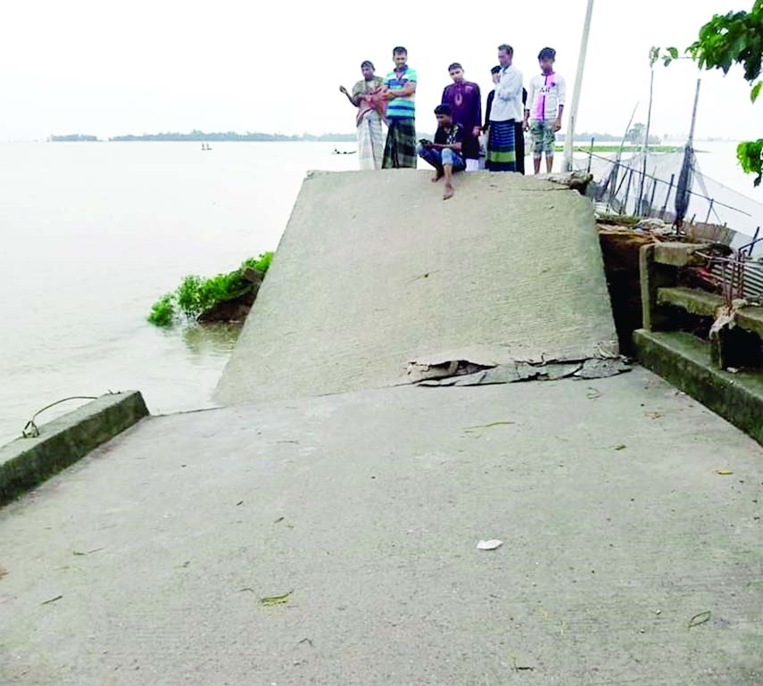 NASIRNAGAR (Brahmanbaria): Heavy rainfall and hilly water break a bridge at Burishwar Union in Nasirnagar Upazila . The snap was taken on Monday.