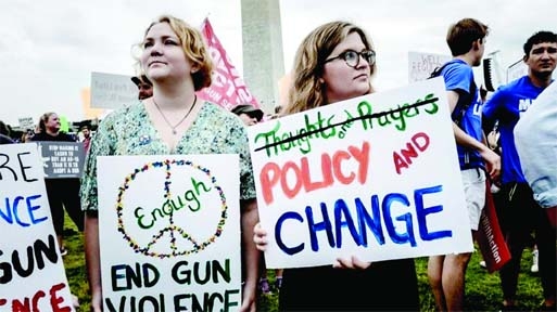 Americans stage protest calling for stricter gun control laws.