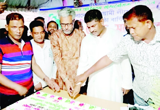 JALDHAKA (Nilphamari): Abdul Wahed Bahadur, Chairman, Jaldhaka Upazila Parishad cuts a cake marking the founding anniversary of Awami League on Thursday .
