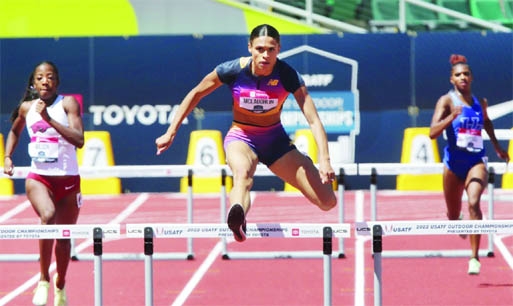 Sydney McLaughlin sets a world record in the women's 400-meter hurdles at the U.S. track and field championships on Saturday.