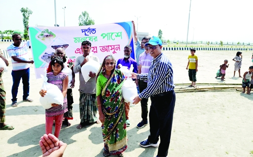 GAIBANDHA: Saidur Rahman, Additional Chief Engineer (Dredging) of BIWTA distributes relief materials among flood affected people in Gaibandha recently.