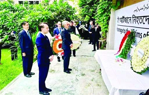 Diplomats of different countries pay floral tributes at the altar in the city's Gulshan on Friday marking the sixth anniversary of Holey Artisan Bakery attack.