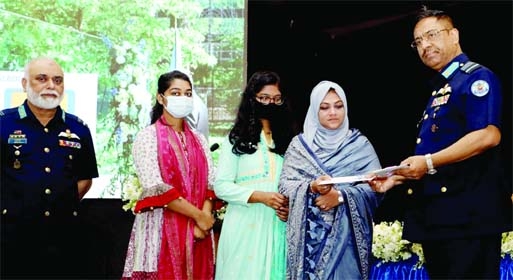 Chief of Air Staff Air Chief Marshal Shaikh Abdul Hannan distributes cheques among the families of martyred peacekeeping forces at Eagle Hall of Dhaka Cantonment on Thursday.