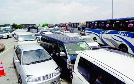 Vehicles get clogged at the Dhaka-Bhanga Expressway on Friday, as all the toll collection booths on the Expressway were not operational.
