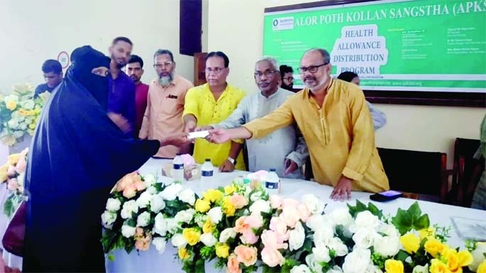 ATWARI (Panchagarh): Md Touhidul Islam, Chairman, Upazila Parishad distributes Financial aid among the distressed people at Atwari Upazila as the Chief Guest on Friday organised by Alor Poth Kallan Sangstha, a Dhaka based social organisation.
