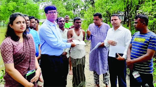 SYLHET: Md Mozibur Rahman, DC, Sylhet distributes money among flood affected people at Beanibazar for house repair from PM's Relief Fund on Wednesday.