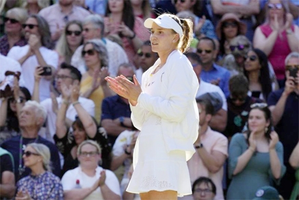 Kazakhstan's Elena Rybakina applauds after beating Romania's Simona Halep in a women's singles semifinal match on day eleven of the Wimbledon tennis championships in London on Thursday.