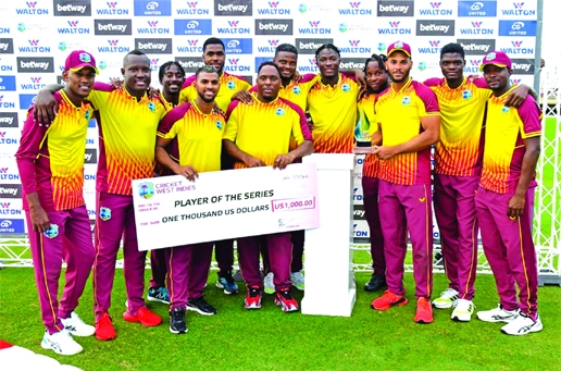 Players of West Indies pose for photo session with the trophy after winning the T20I series 2-0 against Bangladesh at Providence Stadium in Guyana on Thursday.