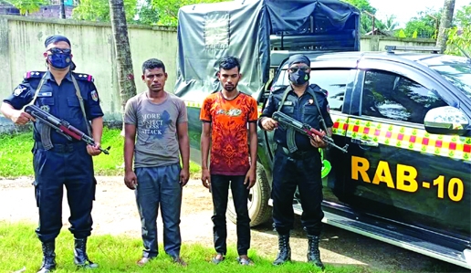 RAB-10 detains two drug traders with phesidyl and hemp conducting raid at Keraniganj on Friday.