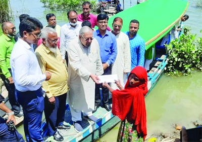 SYLHET: Minister for Expatriate Welfare and Overseas Employment Imran Ahmed distributes housing materials and relief among the flood victims at Gowainghat Upazila in Sylhet on Thursday.