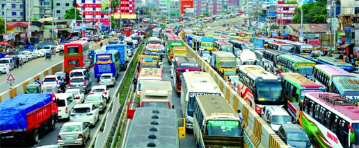 A long queue of traffic on the Dhaka-Mawa Highway leading to Padma Bridge at Dolairpar in the capital on Friday pains the Eid home-goers most.