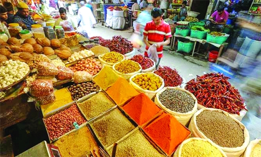 As many Dhaka dwellers started to leave their home in the capital, a few customers are seen in a city spice market on Friday.