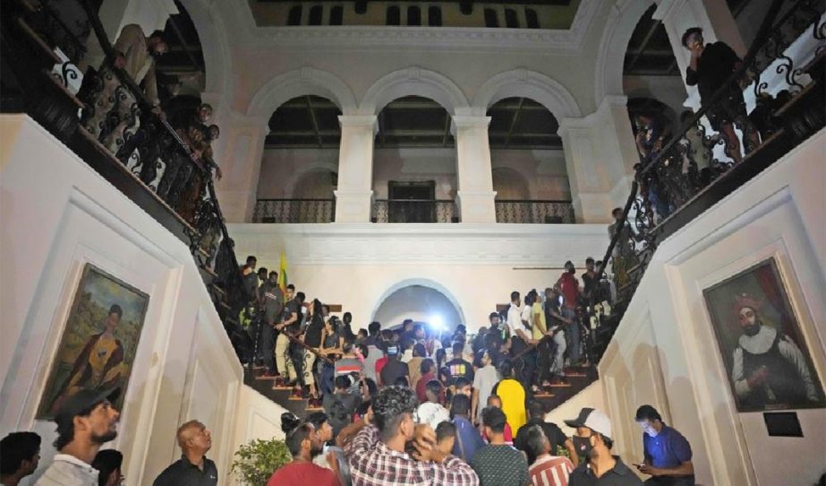 Protesters storm in at the Sri Lankan president's official residence, in Colombo, Sri Lanka , Saturday, July, 9, 2022.