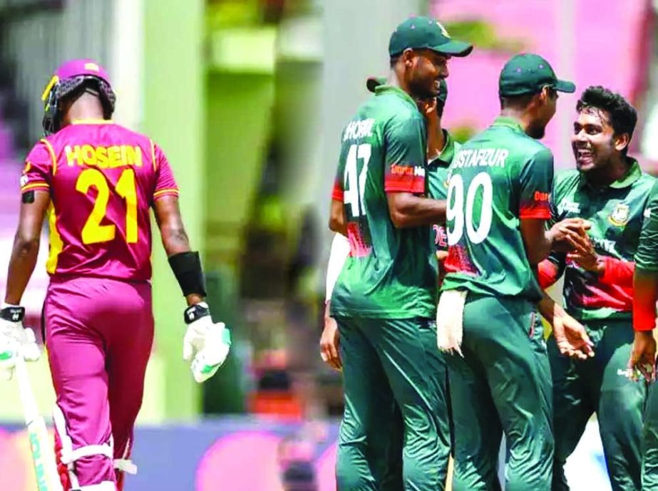 Mehedi Hasan Miraz (right) of Bangladesh celebrates with his teammates after dismissal of Akeal Hosein of West Indies during their second One Day International match at Providence Stadium in Guyana on Wednesday. Agency photo