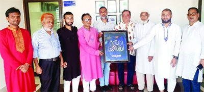 Sylhet calligraphy Society President AH Mahmud Raza Chowdhury along with its leaders handes over a calligraphy to Sylhet City Center authority in a formal ceremony in Sylhet on Friday.