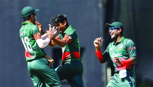 Left-arm spinner Taijul Islam (centre) of Bangladesh celebrates with his teammate Afif Hossain after dismissal of a wicket of West Indies during their third One Day International (ODI) match at Providence Stadium in Guyana on Saturday.