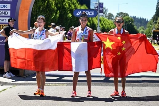 (From left) Poland's Katarzyna Zdzieblo, Peru's Kimberly Garcia Leon and China's Qieyang Shijie pose after competing in the women's 20km race walk final during the World Athletics Championships in Eugene, Oregon on Friday.