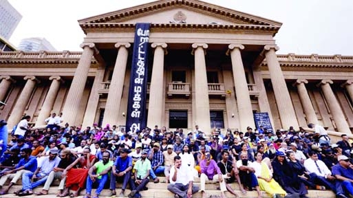 Sri Lankan protesters in Colombo demand the ouster of Ranil Wickremesinghe on Wednesday shortly before parliament voted the six-time PM as the country's new president.