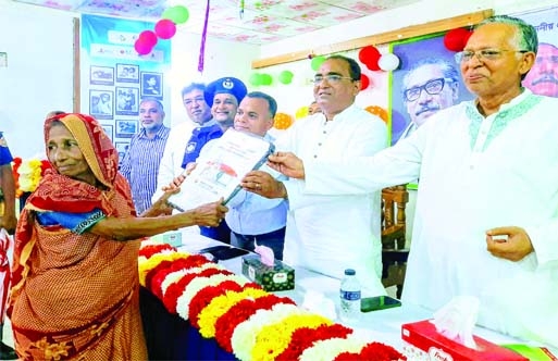 BHOLA: Ali Azam Mukul MP distributes keys and documents of houses among the landless, poor masses at Borhanuddin Upazila on Thursday.