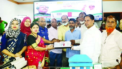BHANDARIA (Pirojpur) : Seema Rani Dhar, UNO, Bhandaria Upazila hands over documents of land among the poor people at Upazila organised by Upazila Administration on Thursday.