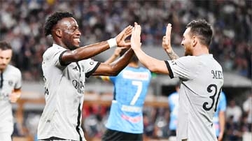 Paris Saint-Germain's French forward Arnaud Kalimuendo (left) celebrates his goal with Argentine forward Lionel Messi (right) during PSG's Japan tour football match against Kawasaki Frontale at the National Stadium in Tokyo on Wednesday.