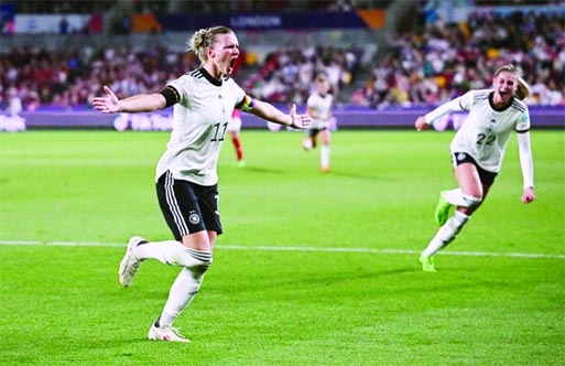 Germany's Alexandra Popp (left) celebrates scoring their second goal during the women's Euro 2022 quarterfinal against Austria at Brentford Community Stadium, London on Thursday.