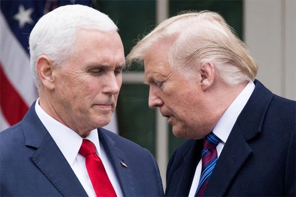 Ex-US President Donald Trump and his ex-wingman Mike Pence looking at each other to show rivalry to gain Republican candidature for the coming US Presidency.