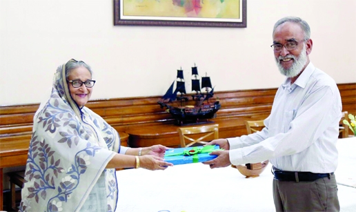 Comptroller and Auditor General of Bangladesh Muslim Chowdhury hands over a total of 53 audits and account reports and two special audits report to Prime Minister Sheikh Hasina at her official residence Ganabhaban on Thursday.