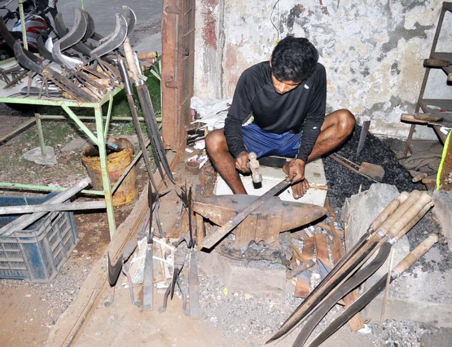 Blacksmiths are passing busy time ahead of Eid -ul- Azha at Chittagong on Tuesday.