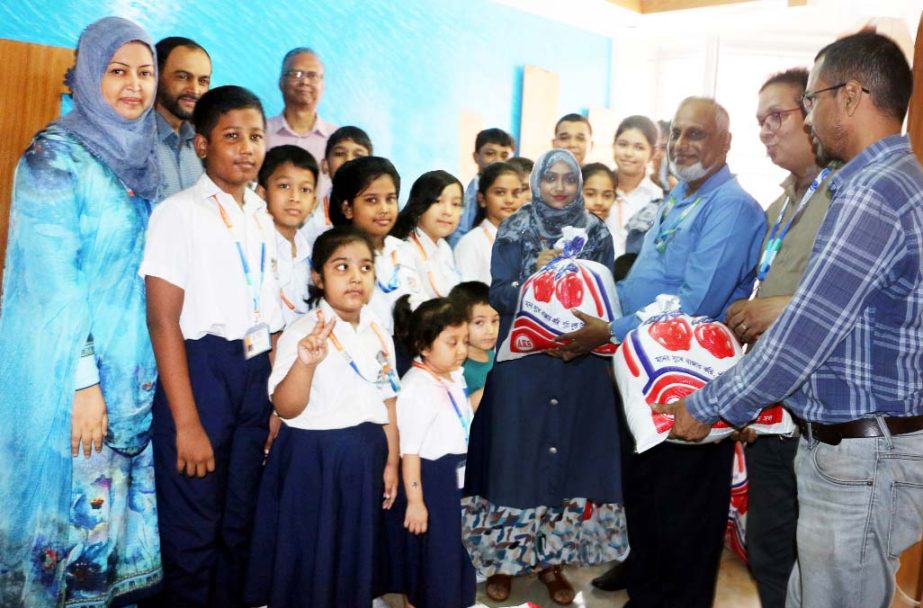 Students of Social Welfare Club of Daffodil International School handing over the relief goods to the Relief Fund of Directors of Student Affairs of Daffodil International University on Monday.