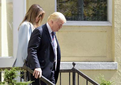 President Donald Trump and first lady Melania Trump leave after attending services at St. John's Church in Washington on Sunday.