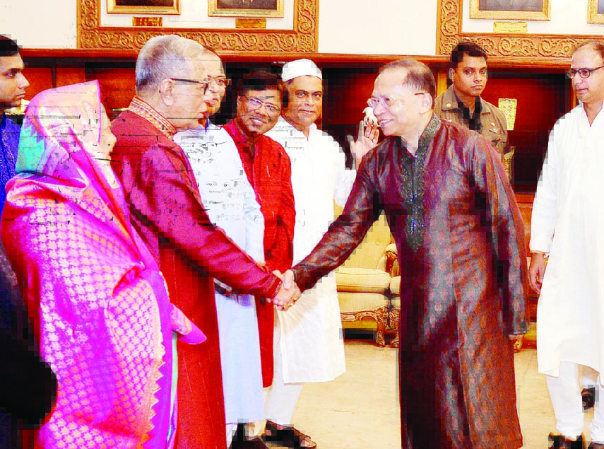 President Abdul Hamid shaking hands with Chief Justice Surendra Kumar Sinha at Bangabhaban on Saturday during exchanging greetings on the occasion of holy Eid-ul-Azha. Press Wing, Bangabhaban photo