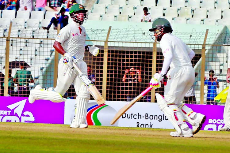 Sabbir Rahman (left) and Mushfiqur Rahim running between wicket during 1st day play of the 2nd Test between Bangladesh and Australia at Zahur Ahmed Chowdhury Stadium in Chittagong on Monday.