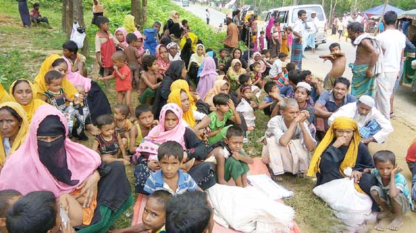 Rohingya refugees waiting for relief materials in a refugee camp in Coxâ€™s Bazarâ€™s Ukhiya Upazila on Monday.