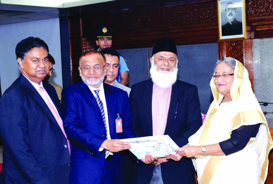 Md Nurun Newaz Salim, Chairman and Mosleh Uddin Ahmed, Managing Director of NCC Bank Limited, handing over a cheque of Tk 3 crore to Prime Minister Seikh Hasina for the flood-affected people at Ganabhaban recently. Md Nazrul Islam Mazumder, Chairman of Ba