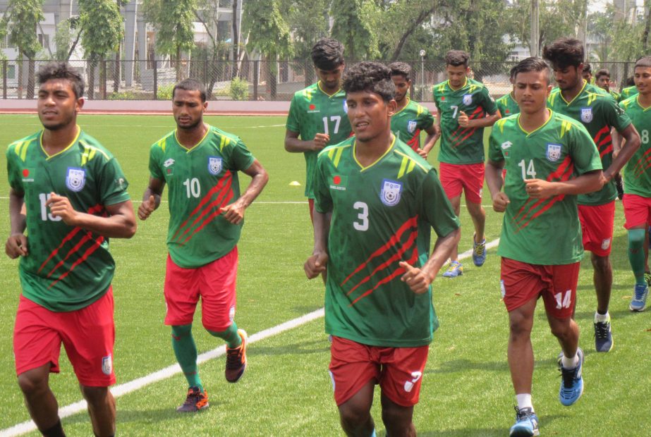 Members of Bangladesh National Under-18 Football team during their practice session at the BKSP Ground on Tuesday.