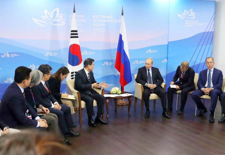 Russian President Vladimir Putin (third from right) listens to South Korean President Moon Jae-in (fifth from left) during their meeting at the Eastern Economic Forum in Vladivostok on Wednesday.