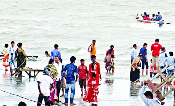People gathered at Patenga Sea Beach in Chittagong on Tuesday.