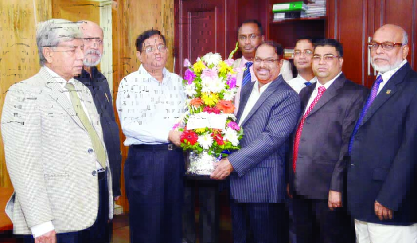President of Bangladesh Insurance Forum and CEO of Popular Life Insurance Company Ltd BM Yousuf Ali greeting newly-appointed Chairman of Insurance Development and Regulatory Authority (IDRA) Md Shafiqur Rahman Patwary at his office yesterday.