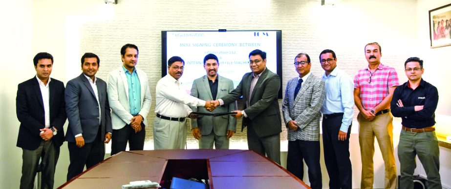 Shameem Ahsan, Chairman of eGeneration Group and Rezaul Karim, Director of International Office Machines (sole distributor of Toshiba, NEC, Zebra Technologies), exchanging agreement signing documents in the city recently. Under the deal, eGeneration will