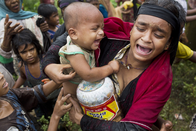 A Rohingya woman breaks down after a fight erupted during food distribution by local volunteers at Kutupalong, Bangladesh on Friday.